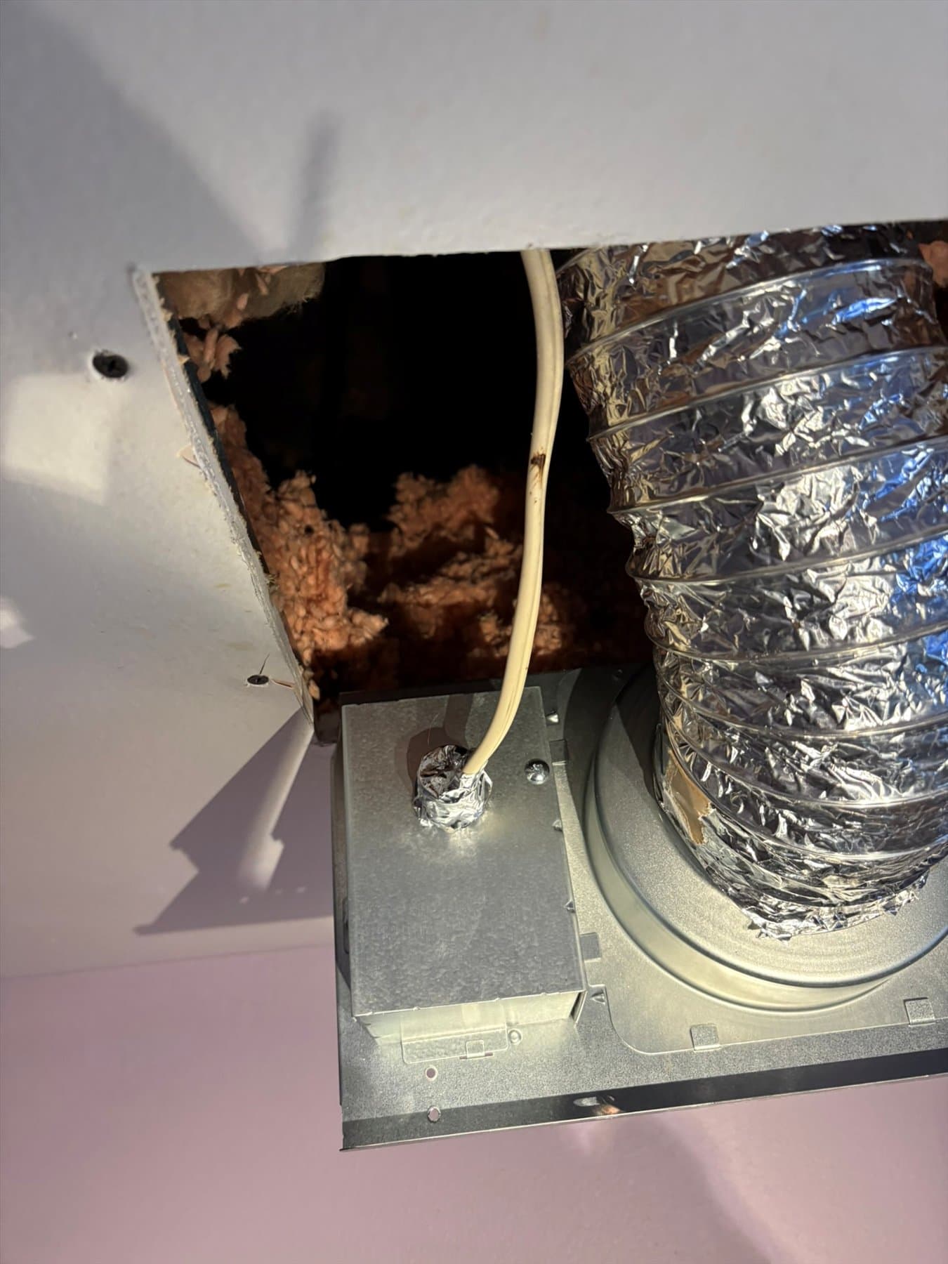 Incorrect framing and ceiling opening around the old bathroom fan