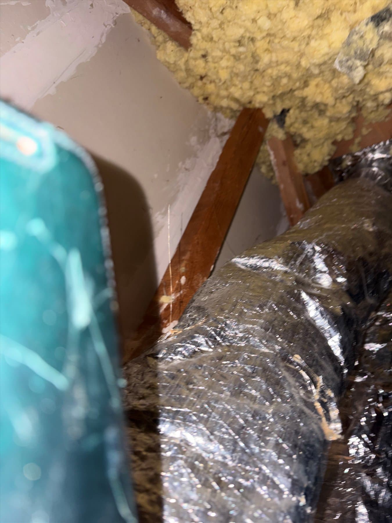 Insulation and ductwork above a bathroom ceiling
