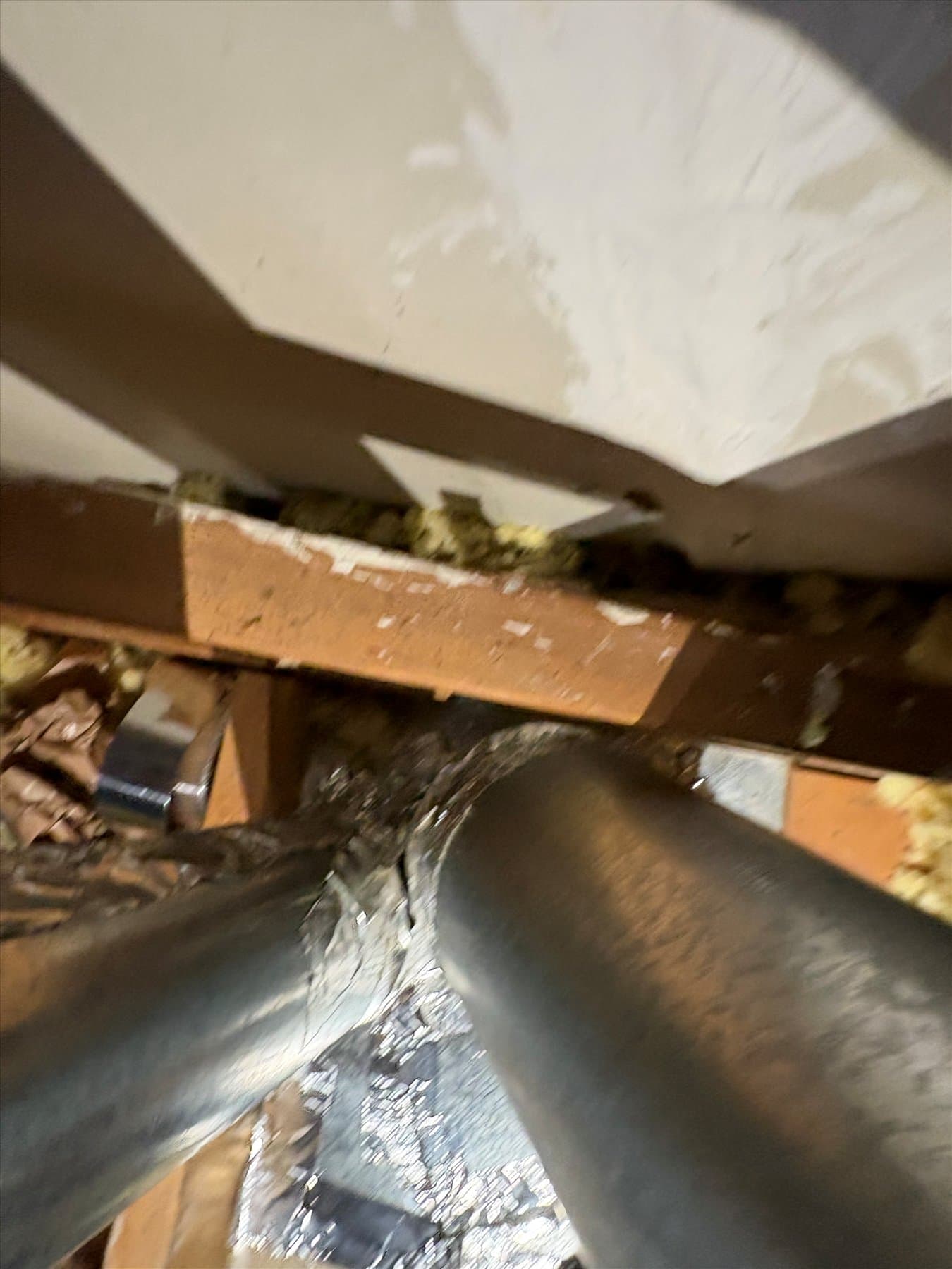 Bathroom fan duct connection in the ceiling cavity