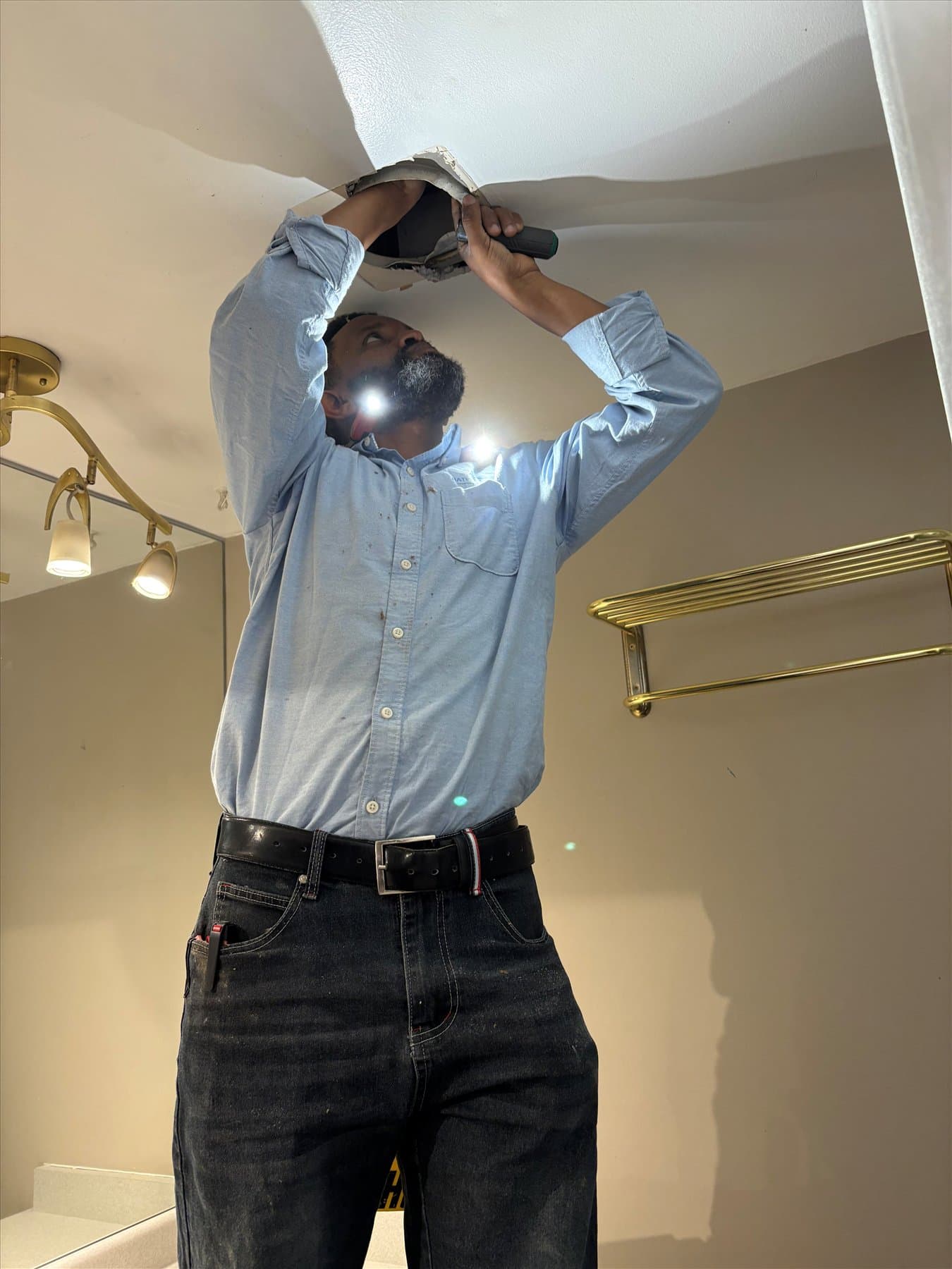 Bathroom Fan Pros installer at the Mount Pleasant fan replacement