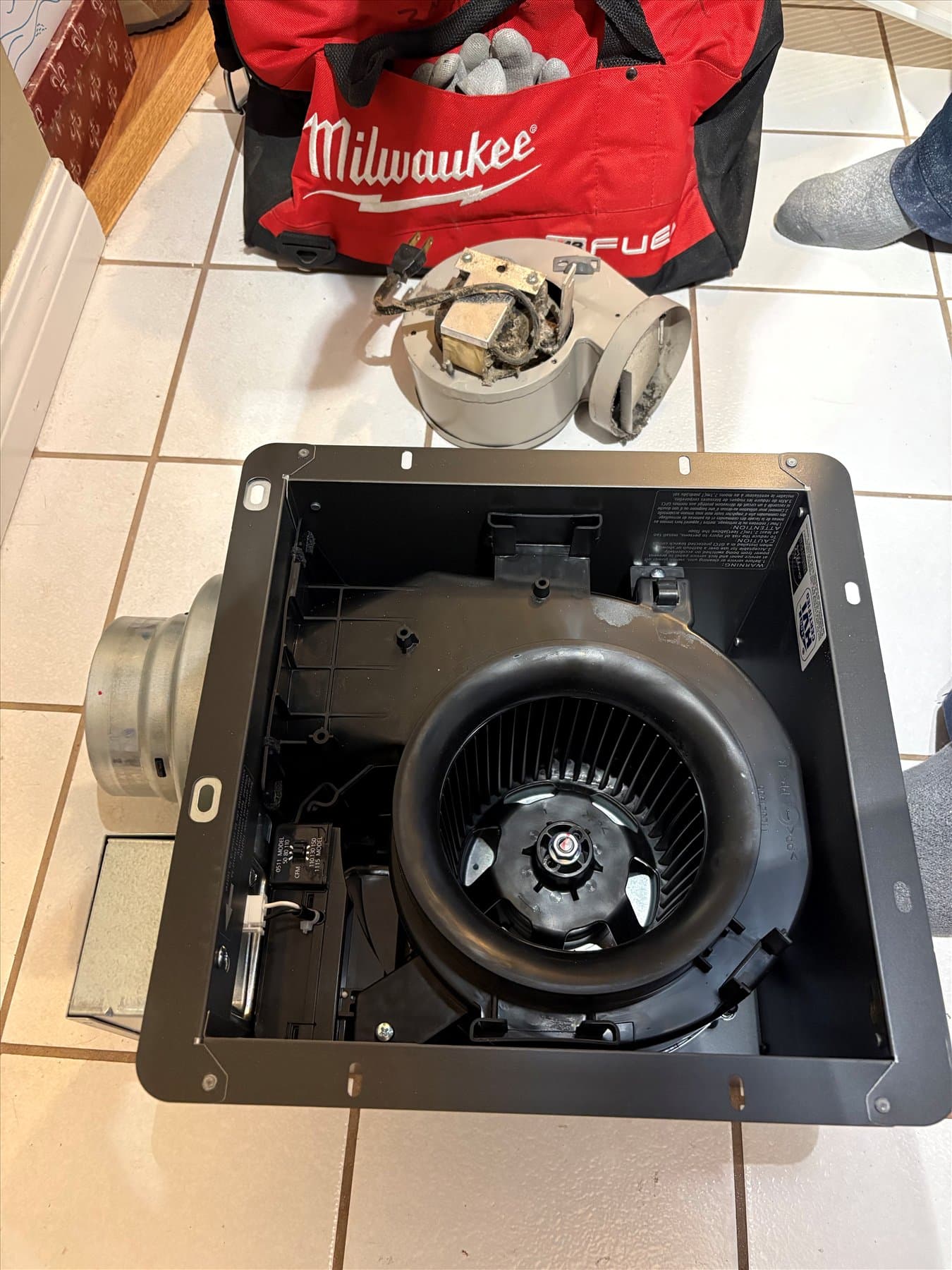 Removed bathroom fan housing and tools