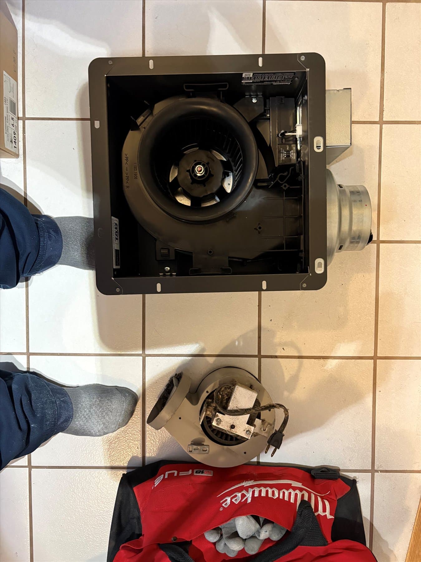 Old bathroom fan motor removed from the ceiling