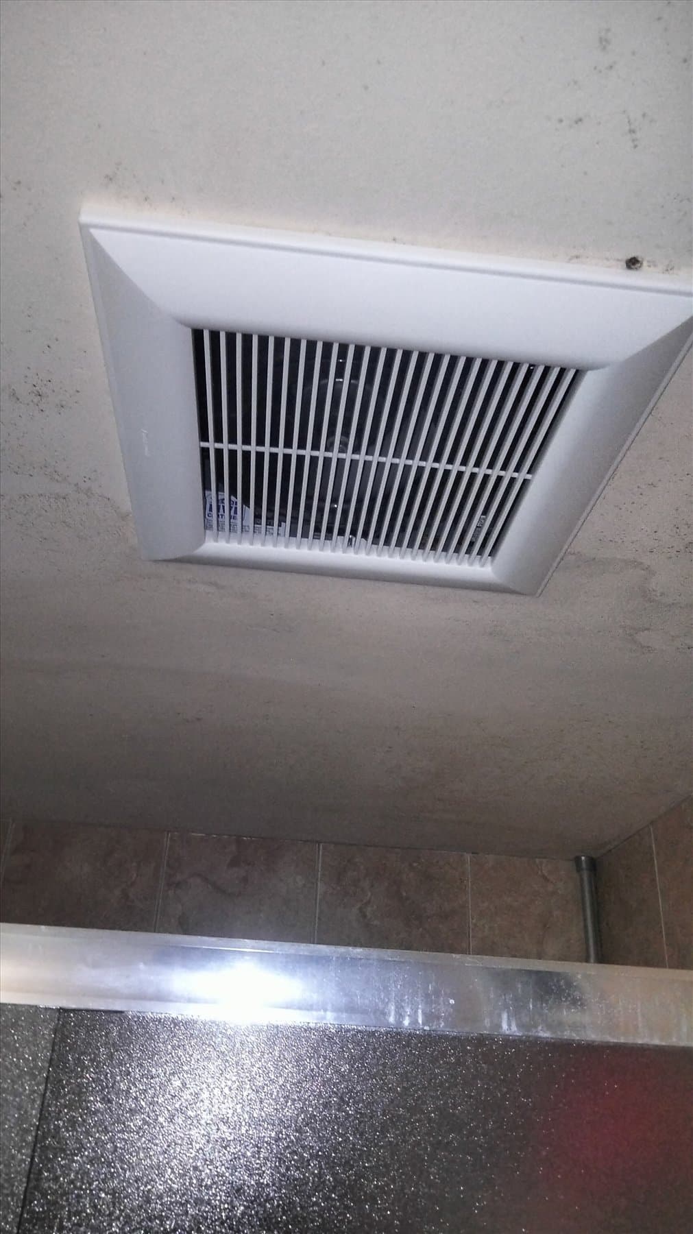 Bathroom fan housing and replacement components during the work