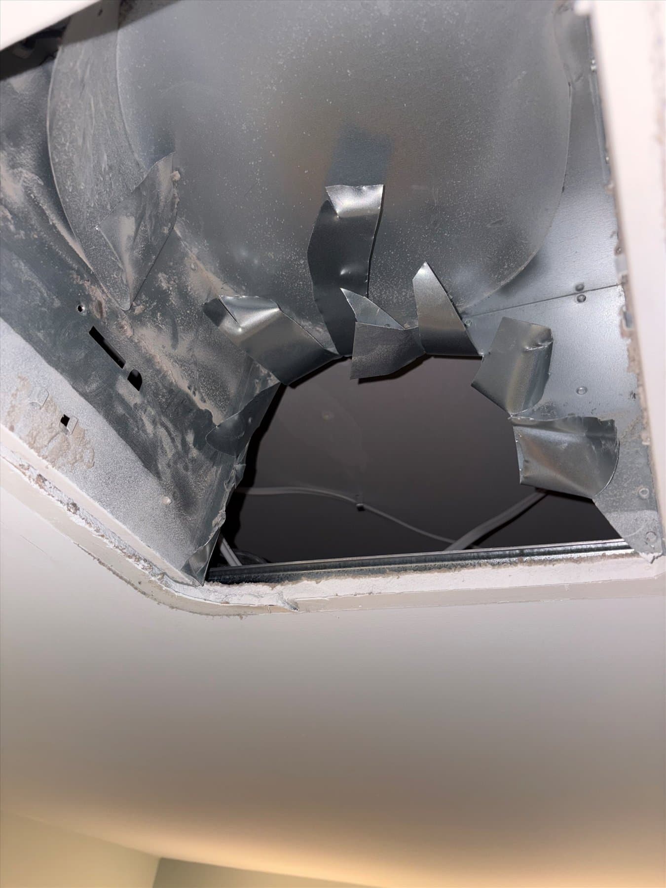 Failed bathroom fan housing removed from the ceiling